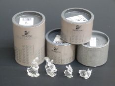 Four Swarovksi Crystal Animals three Rabbits and Squirrel, largest 5cm tall,