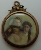A Victorian double sided locket set with two finely painted miniatures on ivory,