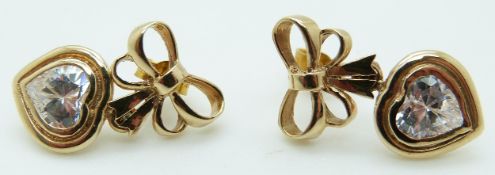 A pair of 9ct gold earrings set with a heart shaped cubic zirconia to each, 4.