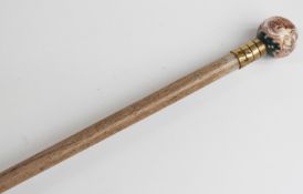 A 19thC/20thC parasol with spherical porcelain handle decorated with Watteau scene,