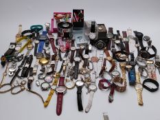 A collection of approximately ninety ladies and gentleman's mostly contemporary wristwatches