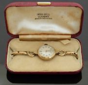 Ladies 9ct gold wristwatch with inset subsidiary seconds dial,