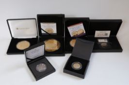 A collection of gold plated commemorative coins etc includes 'super size' 10oz and 5oz examples,