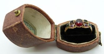 Victorian ring set with a bohemian cut garnet to the centre and further gemstones to the shoulders