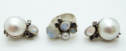 A silver ring set with pearl, moonstone and sapphires by Gatto Bianco,