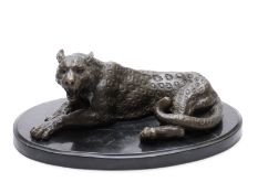 Bronze reclining leopard with possibly Eastern signature / stamp to rear, on oval base,