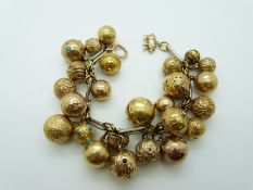 A bi-coloured bracelet with 25 sphere / orb charms including a Masonic charm,