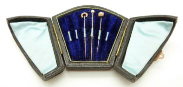 Three Victorian stick pins set with pearls in original box.