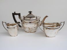 George V hallmarked silver three piece teaset, Sheffield 1910, maker Martin, Hall & Co,