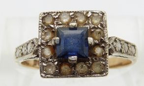 A 9ct gold ring set with a square cut synthetic sapphire and paste,