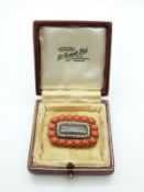 Victorian mourning brooch set with coral and seed pearls, 2.5 x 3.