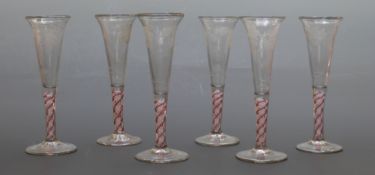 A set of six 19thC engraved wine glasses with latticino swirl stems