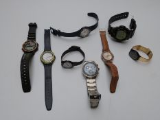 Six Swatch wristwatches including chronograph and day-date examples together with a Casio G-Shock