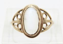 A 9ct gold ring set with a moonstone cabochon,