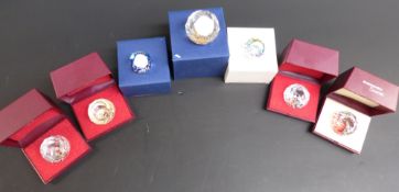 Seven Swarovski Crystal cut glass paperweights