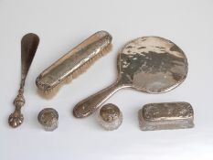 A quantity of hallmarked silver mounted dressing table items comprising hand mirror, shoe horn,