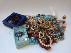 A collection of jewellery including beads