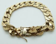 A gentleman's 9ct gold curb link bracelet with textured finish, 45.