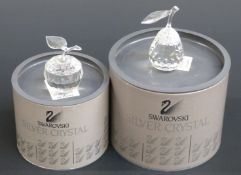 Two Swarovski Crystal cut glass paperweights one in the form of an apple, the other a pear,