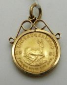 A 1981 1/10 Krugerrand coin in 9ct gold clip mount, 4.