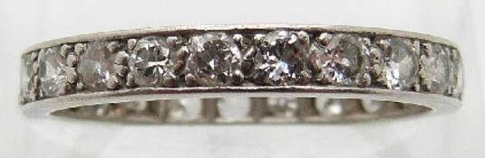 A platinum ring set with 23 brilliant cut diamonds, each approximately 0.