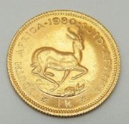A 1980 gold South African one rand,