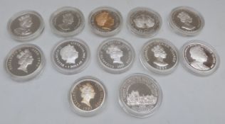 Silver Royal Commemorative crown sized coins in capsules,