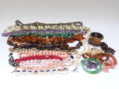A group of necklaces including malachite, amber, pearl and agate, Victorian agate brooch,