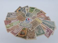 A collection of bank notes including various versions of Chinese 1930s Bank of Ming Tung half money,