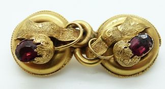 An early Victorian brooch set with two garnets in a stylized buckle design, 5.