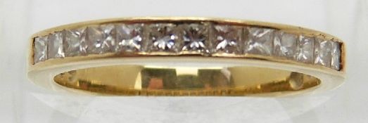 An 18ct gold half eternity ring set with 13 princess cut diamonds,