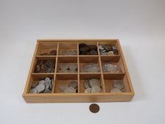 An amateur collection of UK and overseas coins to include silver content, white metal restrikes,