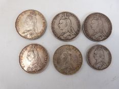 Six Victoria jubilee head coins to include crowns, double florin (one ex-mount) and a half crown,