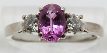 An 18ct white gold ring set with an oval pink sapphire of approximately 0.