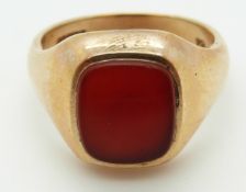 A 9ct gold seal ring set with carnelian agate, Size U, 10.