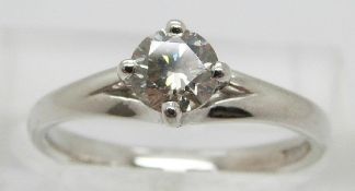 An 18ct white gold ring set with a round brilliant cut diamond solitaire of approximately 0.