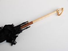 Late 19thC/20thC parasol with carved ivory handle and suspension loop inset with two turquoise