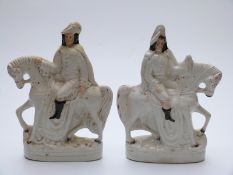 A pair of Staffordshire flatback figures of men on horseback,