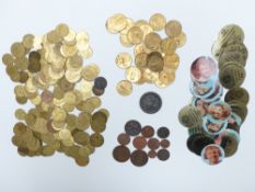 A large collection of Victorian brass counters together with some modern fruit machine tokens,