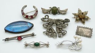 A quantity of silver brooches including marcasite set, Victorian, ceramic scarab beetle, pearl set,