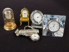A collection of collectable modern pocket watches together with a group of miniature clocks,