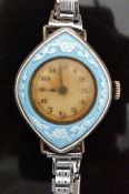 Ladies silver wristwatch with floral decorated blue guilloche enamel bezel, and Arabic numerals,