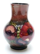 Moorcroft flambé pedestal vase in Anenome pattern with Moorcroft signature to base, 17.