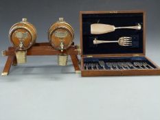 Novelty whisky and brandy dispenser in the form of barrels, width 36cm,