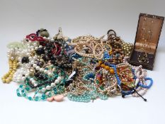 A collection of beaded necklaces including rose quartz