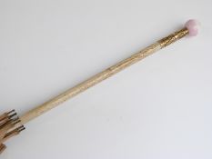 A 19thC/20thC parasol with spherical porcelain handle decorated with Watteau scene,