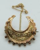 Victorian 9ct gold brooch in the form of a crescent with ivy decoration, Birmingham 1888, 2.94g, 2.