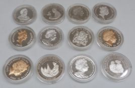 Silver Royal Commemorative crown sized coins in capsules,