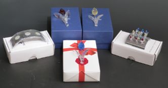 Three Swarovski Crystal cut glass coloured tulips, each 8.