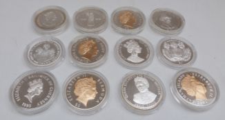 Silver Royal Commemorative crown sized coins in capsules,